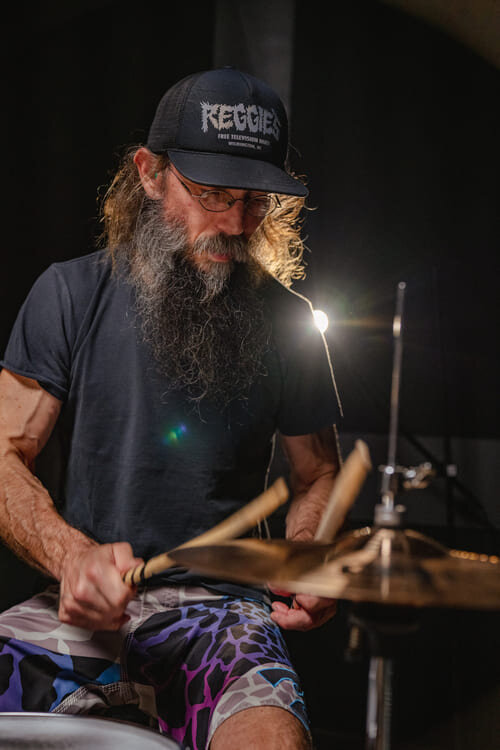 drummer playing on a Tama ImperialStar drum set in a rehearsal studio 