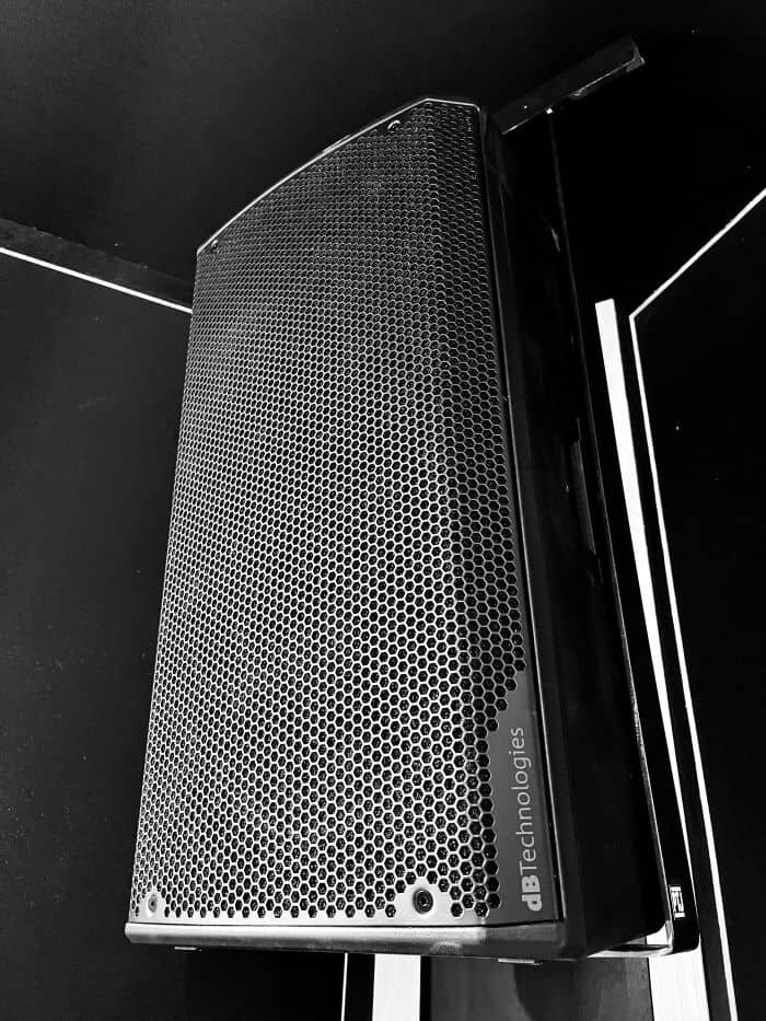 Wall-mounted DB Opera 12 active speaker in DJ studio room near me. | © Plug The Jack